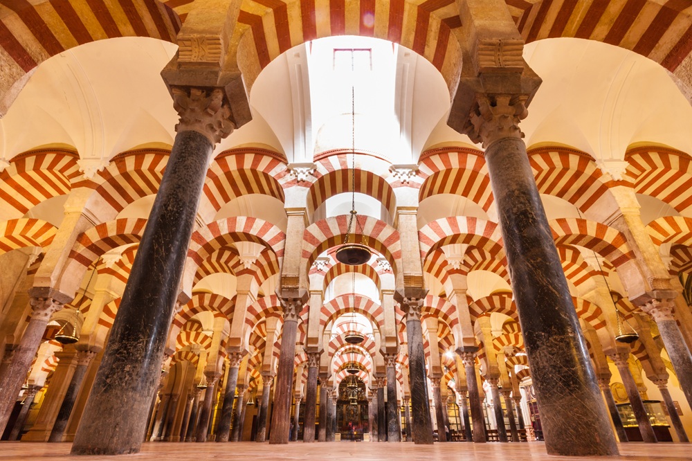 The iconic red and white striped arches inside the Mosque-Cathedral of Córdoba